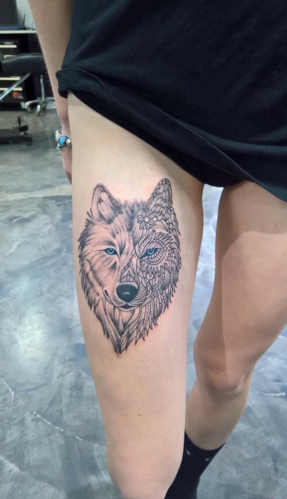 大腿上帅气的半线条半真实狼头纹身图片