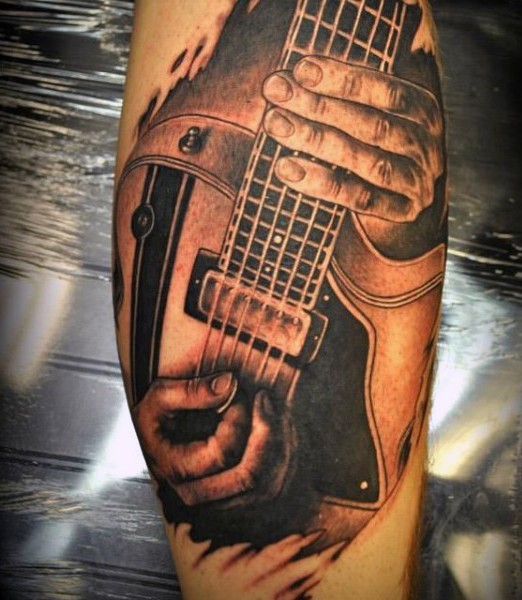 小腿写实音乐家弹吉他纹身图片