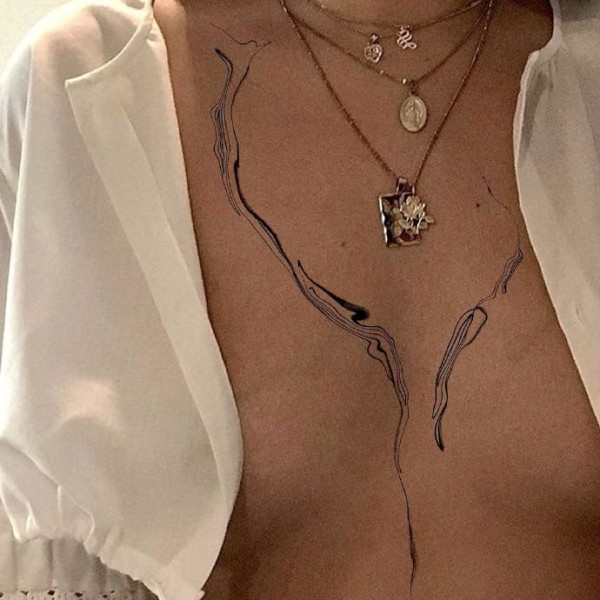 女性身上的一组绝美线条纹身图片